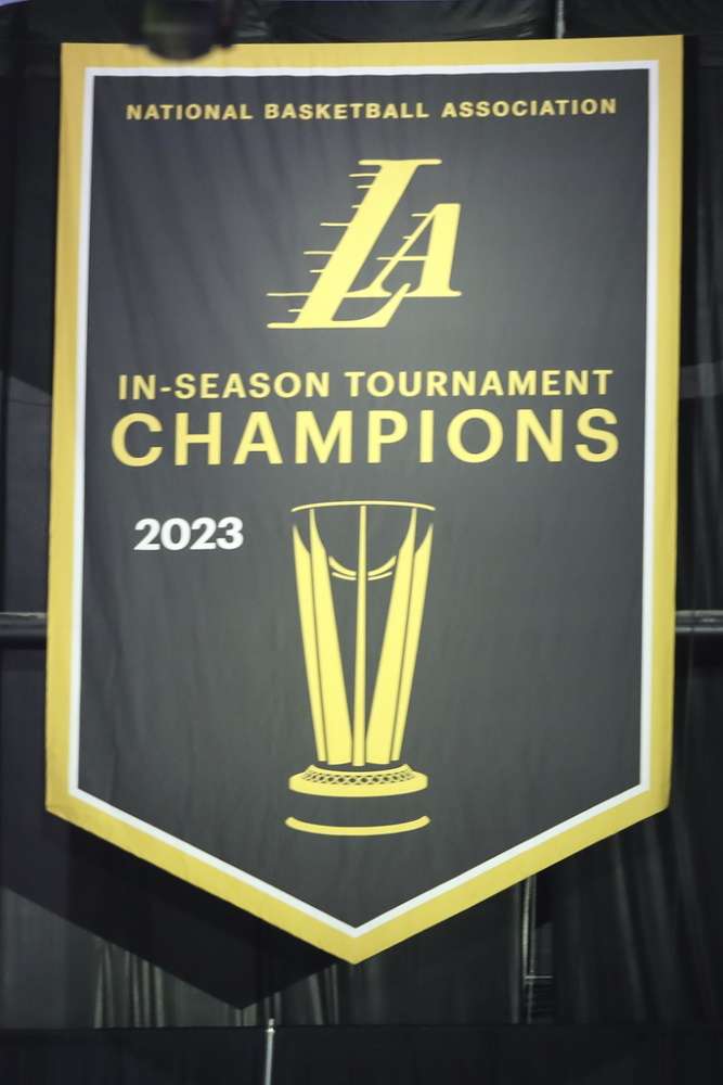 Los Angeles Lakers hang their In-Season Tournament banner during the NBA game between the New York Knicks and the Los Angeles Lakers on December 18, 2023, at Crypto.com Arena in Los Angeles, CA.